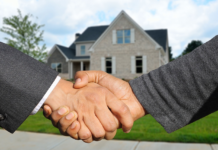 How to Find the Perfect Neighborhood for Your New Home Realtor shaking hands with a client