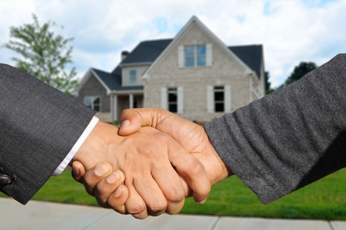 Realtor shaking hands with a client